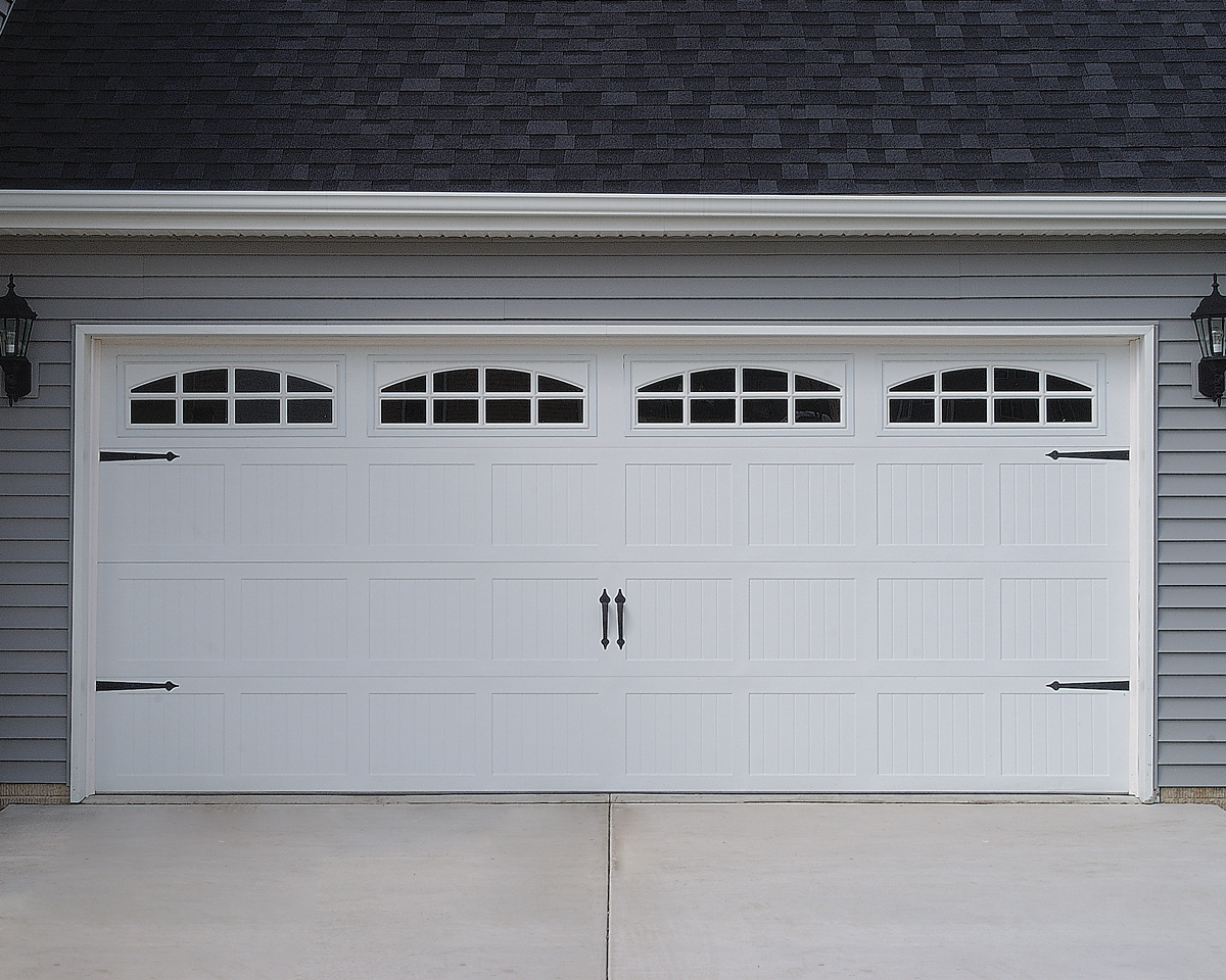 Raynor Carriage House Garage Doors with Stockton Arch Glass